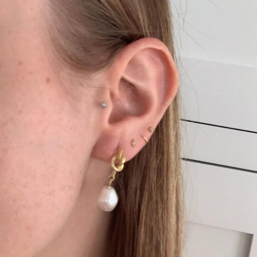 The Christy Huggie gold stud Pearl earrings knot gold